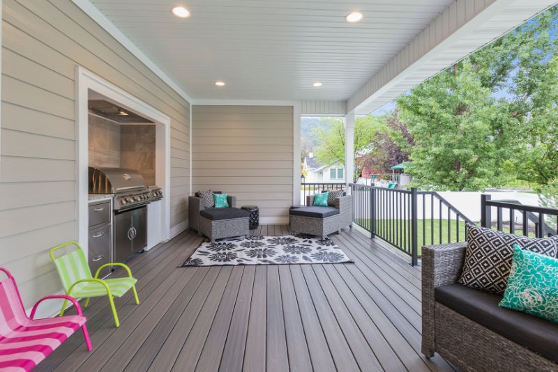 composite decking with outdoor kitchen and sitting area