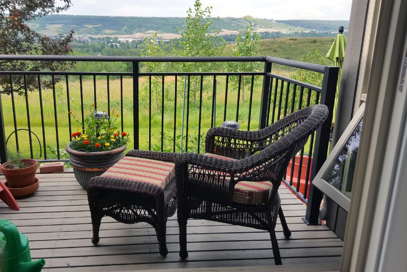 apartmment deck with chair and footrest