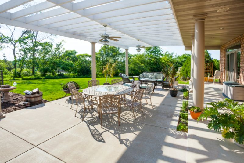 pergola attached to the house with a lounge area