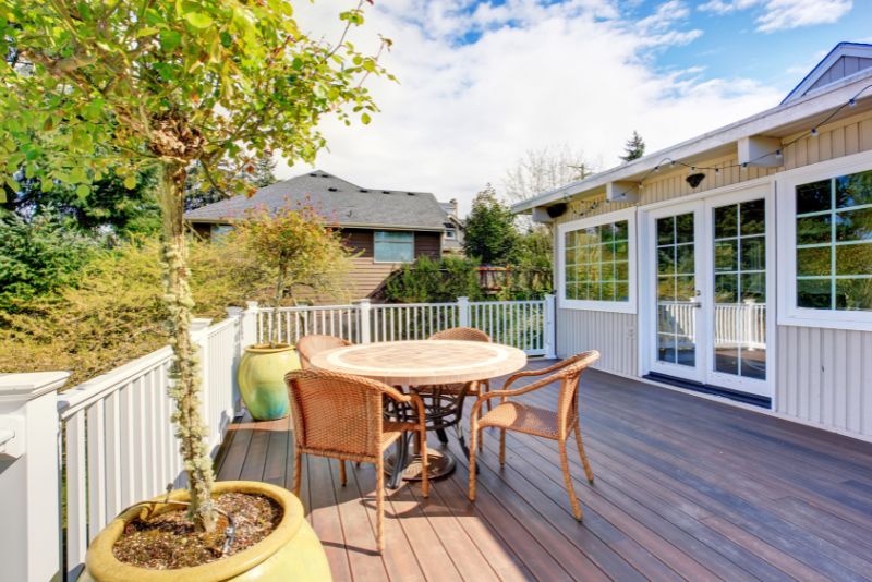 composite deck with a dining table and chairs