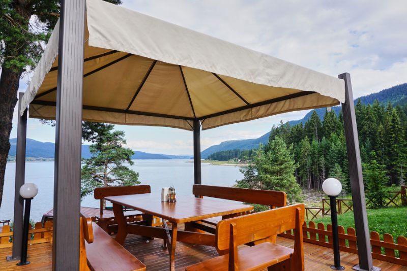 freestanding pergola with a natural view of the lake